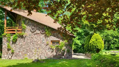 a stone building with a window on the side of it at Hunters Lounge Apartments
