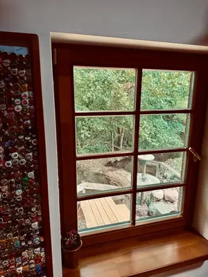 a window in a room with a bunch of wine bottles at Hunters Lounge Apartments