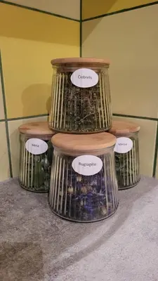 a group of three containers with labels on them at Hunters Lounge Apartments