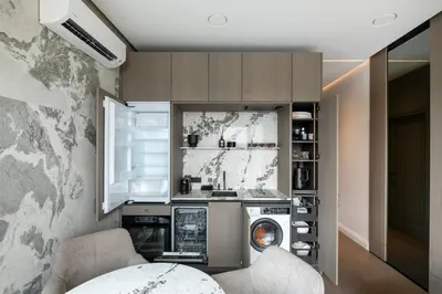 a kitchen with a washer and a washing machine at Sky&River Towe Apartments Kaunas City Center in Kaunas