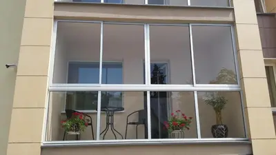 a window with potted plants in a building at Mineral Apartment in Druskininkai