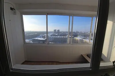 a window in a room with a view of a city at Apartaments Kaunas in Kaunas