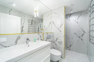 a white bathroom with a sink and a toilet at Modern Loft Apartment with free parking No4 in Marijampolė
