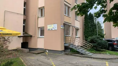 a building with a staircase in front of it at Butas Čiurlionio gatvėje in Pakopi
