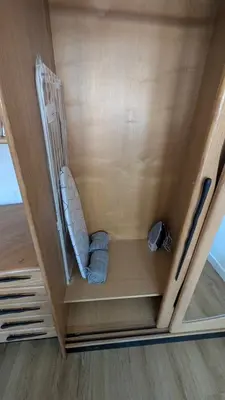 a small room with a chair in the ceiling at Kaunas City Centre Apartment Self Check-In & AC in Kaunas