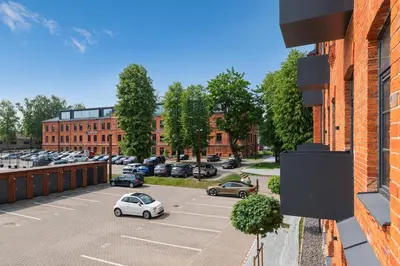 arial view of a parking lot with cars parked at Shanti barracks apartment #3 by Polo Apartments in Kaunas