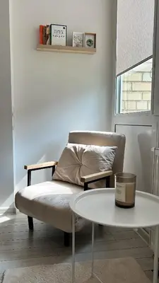 a living room with a couch and a table at Rugilės lelijų apartamentai in Birštonas