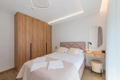 a bedroom with a bed with two towels on it at Modern 2 BD Apartment by Domvia in Kaunas