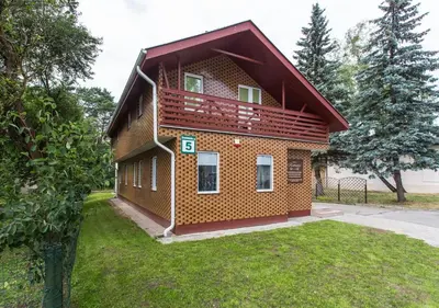 a house with a balcony on top of it at Rinvasta in Druskininkai