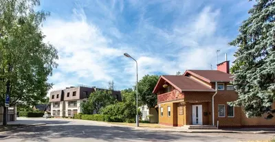 a building on a street with a street light at Rinvasta in Druskininkai
