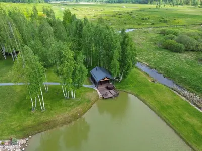 an aerial view of a boat in a river at Žalesos pirtelė in Ažulauke