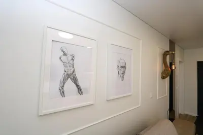 two framed drawings on a wall in a room at Flat for 2 or 1 with Free Parking and Fast Wi-Fi in Vilnius