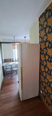 a room with a door and a dining room at Apartamentai The 56 Spot in Utena