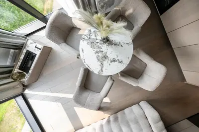 a living room with two chairs and a table at CityView Kaunas Center in Kaunas