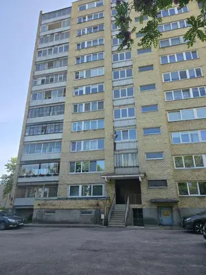 a tall building with a staircase in front of it at Apartaments Kaunas in Kaunas