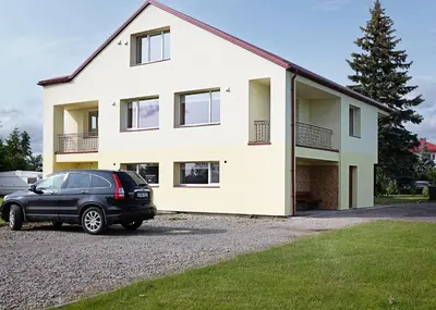 a car parked in front of a house at Degučiai ,svečių namai in Šakiai