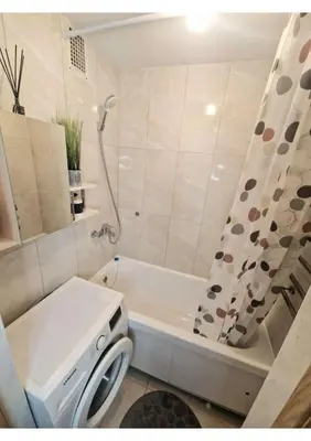 a bathroom with a tub and a toilet and a shower at Pušų lašas apartamentai in Birštonas