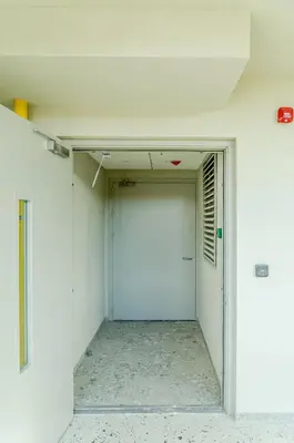 an empty room with a door in a white wall at Activity & Relax Studio 5 in Druskininkai