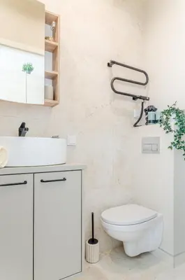 a bathroom with a white toilet and a sink at Activity & Relax Studio 5 in Druskininkai