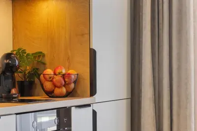 a bowl of fruit on a counter in a kitchen at Niwaki Sodai No 1 by URBAN RENT in Vilnius