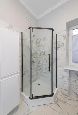 a shower in a bathroom with marble at The Comfort Apartment #2 by Polo Apartments in Kaunas