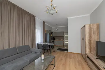 a living room with a couch and a table at The Comfort Apartment #2 by Polo Apartments in Kaunas