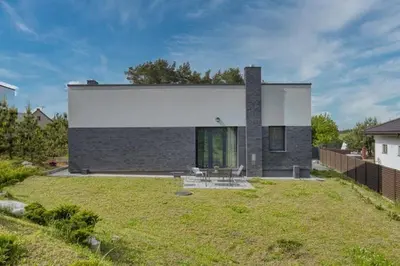 a house with a lawn in front of it at Niwaki Sodai No 2 by URBAN RENT in Vilnius