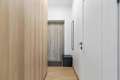 a hallway with a door leading into a room at Niwaki Sodai No 2 by URBAN RENT in Vilnius
