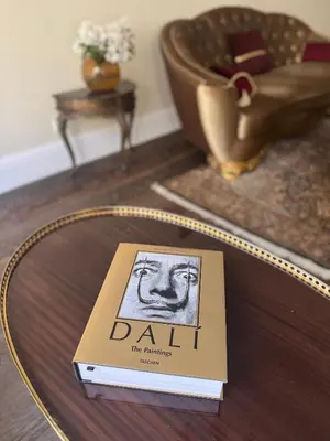 a book sitting on top of a coffee table at Spacious Townhouse in The Heart of Vilnius Old Town in Vilnius