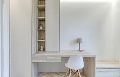 a desk with a white chair in a room at Premium apartment x free parking x 24x7 in Vilnius