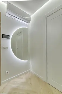a white room with a mirror and a door at Premium apartment x free parking x 24x7 in Vilnius