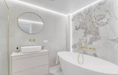 a bathroom with a tub and a sink and a mirror at Premium apartment x free parking x 24x7 in Vilnius