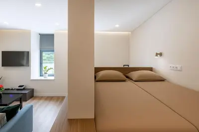 a bedroom with a large bed in a room at Vincent Urban Nest - Near Clinic, Arena and Stadium in Kaunas