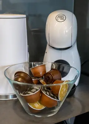 a mixer sitting on a counter with a bowl of chocolate at Vincent Urban Nest - Near Clinic, Arena and Stadium in Kaunas
