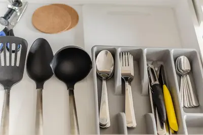 a drawer filled with utensils and spoons and forks at Nemunas A respite Studio 8 in Druskininkai