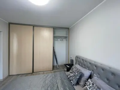 a living room with a couch and a closet at Dani apartment in Panevėžys