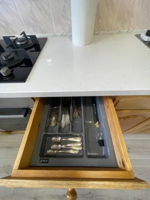 a drawer in a counter with utensils on it at Dani apartment in Panevėžys
