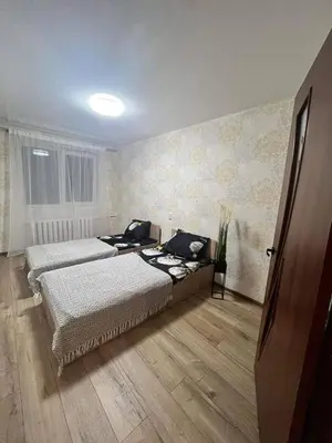 a bedroom with two beds in a room at MB BENO TRUMPALAIKE NUOMA LUKSIUKAs in Kėdainiai