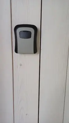 a door with a black and white object on it at Lake apartments in Rokiškis