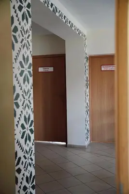 a hallway with two elevators in a building at GP Hostel in Šiauliai