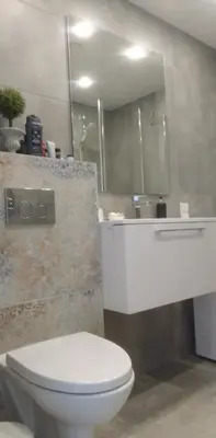 a bathroom with a white toilet and a sink at Buto nuoma Druskininkuose in Druskininkai