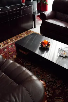 a living room with a coffee table and a couch at GP Hostel in Šiauliai