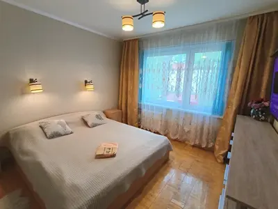 a bedroom with a bed and a window at Weekend Home in Visaginas