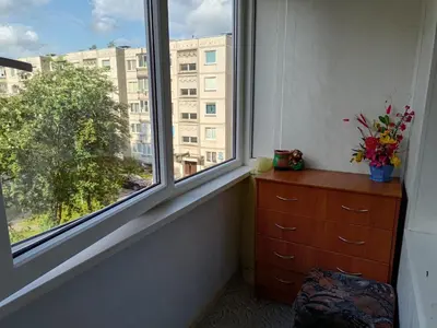 a room with a window with a dresser and a dresser at Weekend Home in Visaginas