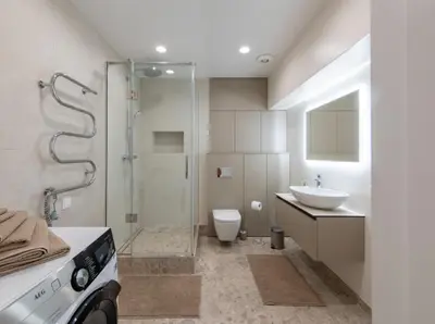 a bathroom with a shower and a toilet and a sink at Opera Escape Studio in Vilnius