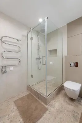 a shower stall in a bathroom with a toilet at Opera Escape Studio in Vilnius
