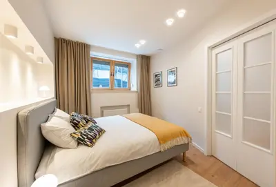 a bedroom with a bed and a window at Opera Escape Studio in Vilnius