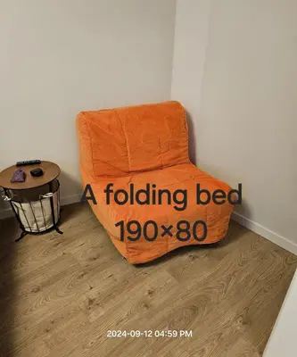 ainding bed sitting in a corner of a room at HaPPy Inn Egle,Self check-in,AC, Parking in garage in Vilnius
