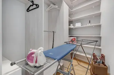 a room with a bed and a table and shelves at HaPPy Inn Egle,Self check-in,AC, Parking in garage in Vilnius
