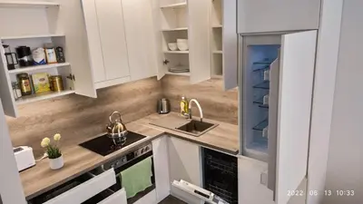 a kitchen with white cabinets and a sink at HaPPy Inn Egle,Self check-in,AC, Parking in garage in Vilnius